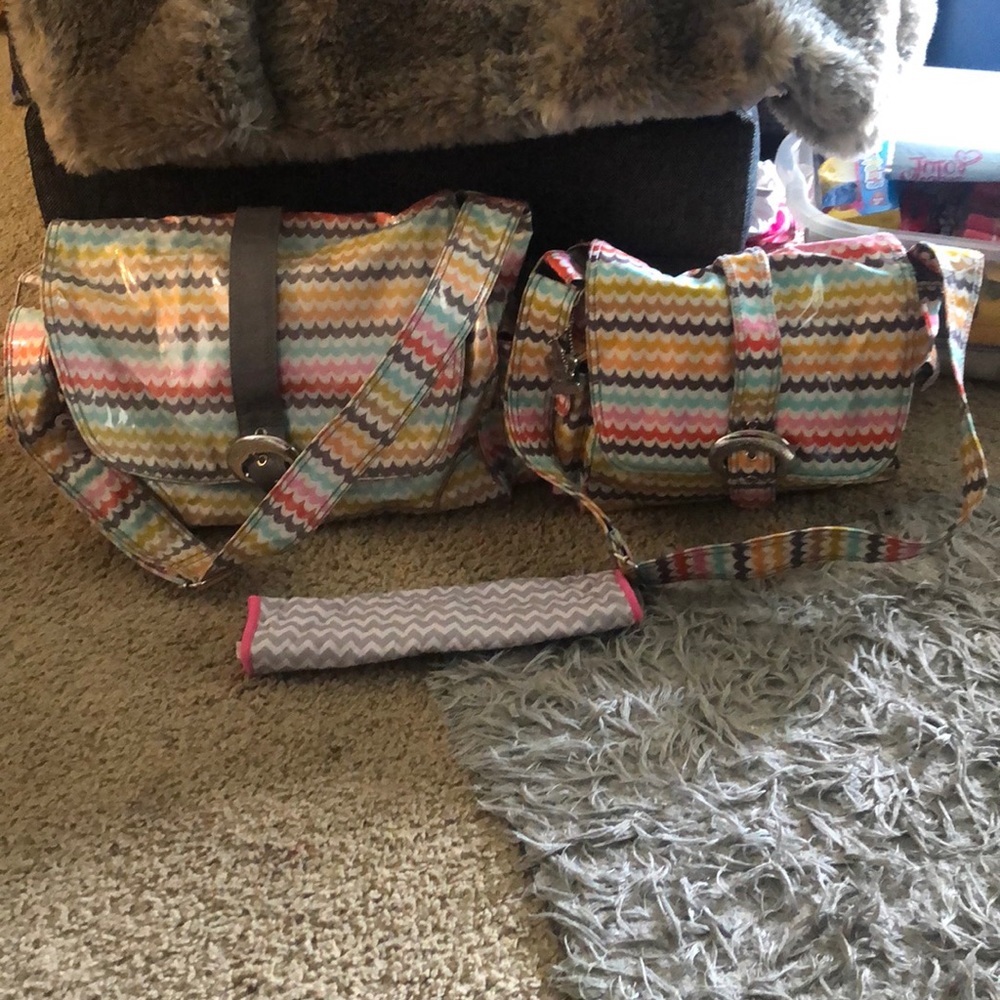 2 matching diaper bags, and a shopping cart pad